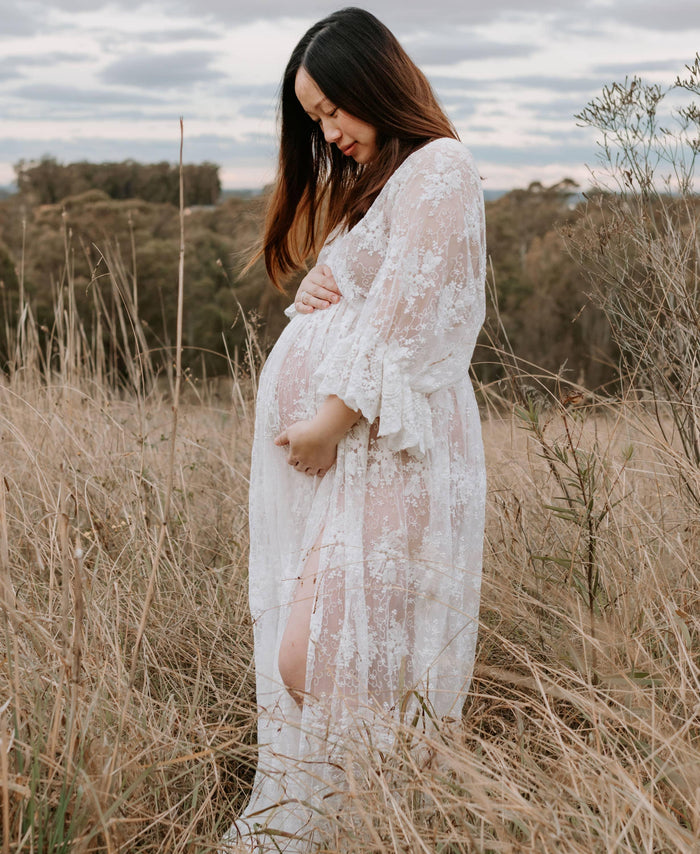 Flattering Ruffle Detail Maternity Dress Hire: Lola Ivory Lace Maternity Maxi Dress